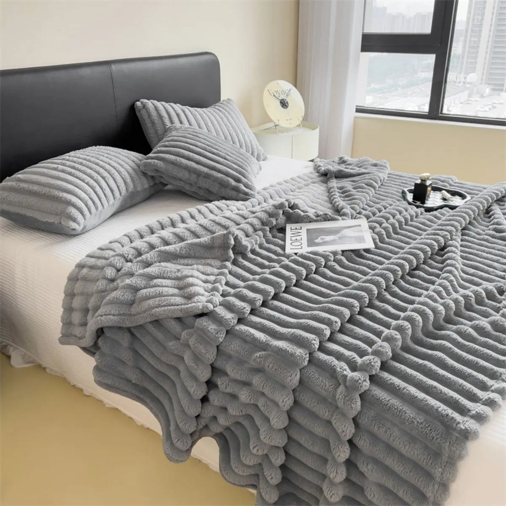 Solid color thickened wide striped multifunctional blanket